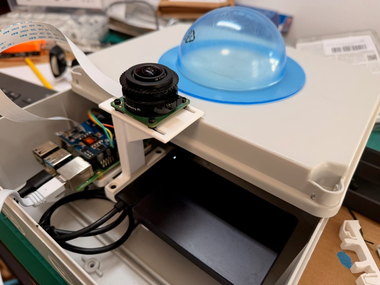 A large pile of 3D-printed prototype parts, several marked with an X as rejects